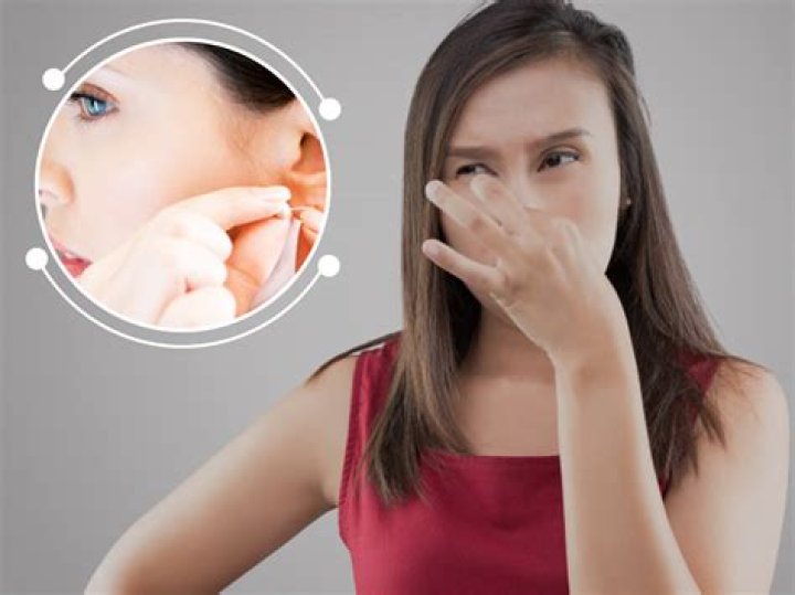 Why is my ear piercing oozing?